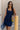 Front view of female model wearing the Stella Dark Denim Wash Sleeveless Mini Dress which features features Dark Denim Wash Fabric, Front Zip-Up Closure, Square Neckline and Sleeveless.