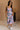 Full body view of female model wearing the Madison Blue and Rose Pink Midi Dress which features Blue and Pink Floral Design, Midi Length,  Sweetheart Neckline and Adjustable Straps.