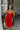 front view of model wearing the Loretta Red Sleeveless Mini Dress that has a tiered skirt, surplice neckline, and thin straps.