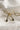 CLose up view of the Alisa Gold & Baguette Stone Bow Shaped Earring which features gold bow tie shaped earring with baguette clear stone details