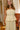 front view of the Sienna Yellow Pleated Top Midi Dress