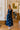 front view of the Roma Blue And White Polka Dot Halter Maxi Dress