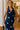 front view of the Roma Blue And White Polka Dot Halter Maxi Dress