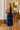 back view of the Roma Blue And White Polka Dot Halter Maxi Dress