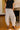 front view of the Briar Cream & Black Stripe Barrel Leg Pants