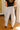 back view of the Briar Cream & Black Stripe Barrel Leg Pants