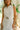 front view of the Posie White Eyelet Mini Dress