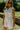 front view of the The Georgia Mae White Button-Up Romper 