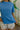 Sloane Blue Pleated Waist Short Sleeve Top- close up view