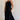 Full body view of female model wearing the Luna Halter Tie Tiered Maxi Dress in black which features  Lightweight Fabric, Tiered Body, Maxi Length, Thigh Length Lining, Halter Neckline with Tie  and Open Back