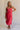 Full body front view of female model wearing the Nova Smocked Tiered Midi Dress which features Lightweight Fabric, Fully Lined, Tiered Ruffle Body, Smocked Upper, Square Neckline and Elastic Straps.
