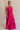  Full body view of female model wearing the Luna Halter Tie Tiered Maxi Dress in Pink which features Lightweight Fabric, Tiered Body, Maxi Length, Thigh Length Lining, Halter Neckline with Tie and Open Back