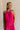 Front view of female model wearing the Luna Halter Tie Tiered Maxi Dress in Pink which features Lightweight Fabric, Tiered Body, Maxi Length, Thigh Length Lining, Halter Neckline with Tie and Open Back