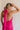 Back view of female model wearing the Luna Halter Tie Tiered Maxi Dress in Pink which features Lightweight Fabric, Tiered Body, Maxi Length, Thigh Length Lining, Halter Neckline with Tie and Open Back