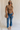 Full body view of female model wearing the Emerson Medium Wash Straight Leg Jeans which features Medium Wash Denim, Two Front Pockets, Two Back Pockets, Front Zipper with Button Closure, Belt Loops and Straight Pant Legs