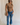 Full body view of female model wearing the Emerson Medium Wash Straight Leg Jeans which features Medium Wash Denim, Two Front Pockets, Two Back Pockets, Front Zipper with Button Closure, Belt Loops and Straight Pant Legs