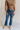 Front view of female model wearing the Emerson Medium Wash Straight Leg Jeans which features Medium Wash Denim, Two Front Pockets, Two Back Pockets, Front Zipper with Button Closure, Belt Loops and Straight Pant Legs