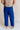 Back view of female model wearing the Freya Cobalt Blue Straight Leg Pants which features Cobalt Blue Cotton Fabric, Wide Pant Legs, Elastic Waistband and Two Side Pockets