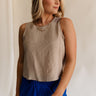 Front view of female model wearing the Sienna Light Taupe Sleeveless Tank which features Lightweight Taupe Fabric, Round Neckline, Sleeveless and Back Key Hole with Button Closure
