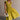 Full body front view of female model wearing the Kristina Chartreuse Smocked Sleeveless Midi Dress that has chartreuse fabric with a smocked upper, ruffle straps, and a midi length hem.