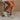 Side view of female model wearing the Alta Sneaker in Off White which features light grey and white suede upper fabric, white sole, and lace up details