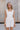 Madilyn White Back Bow Romper- front view