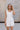 Madilyn White Back Bow Romper- top front view