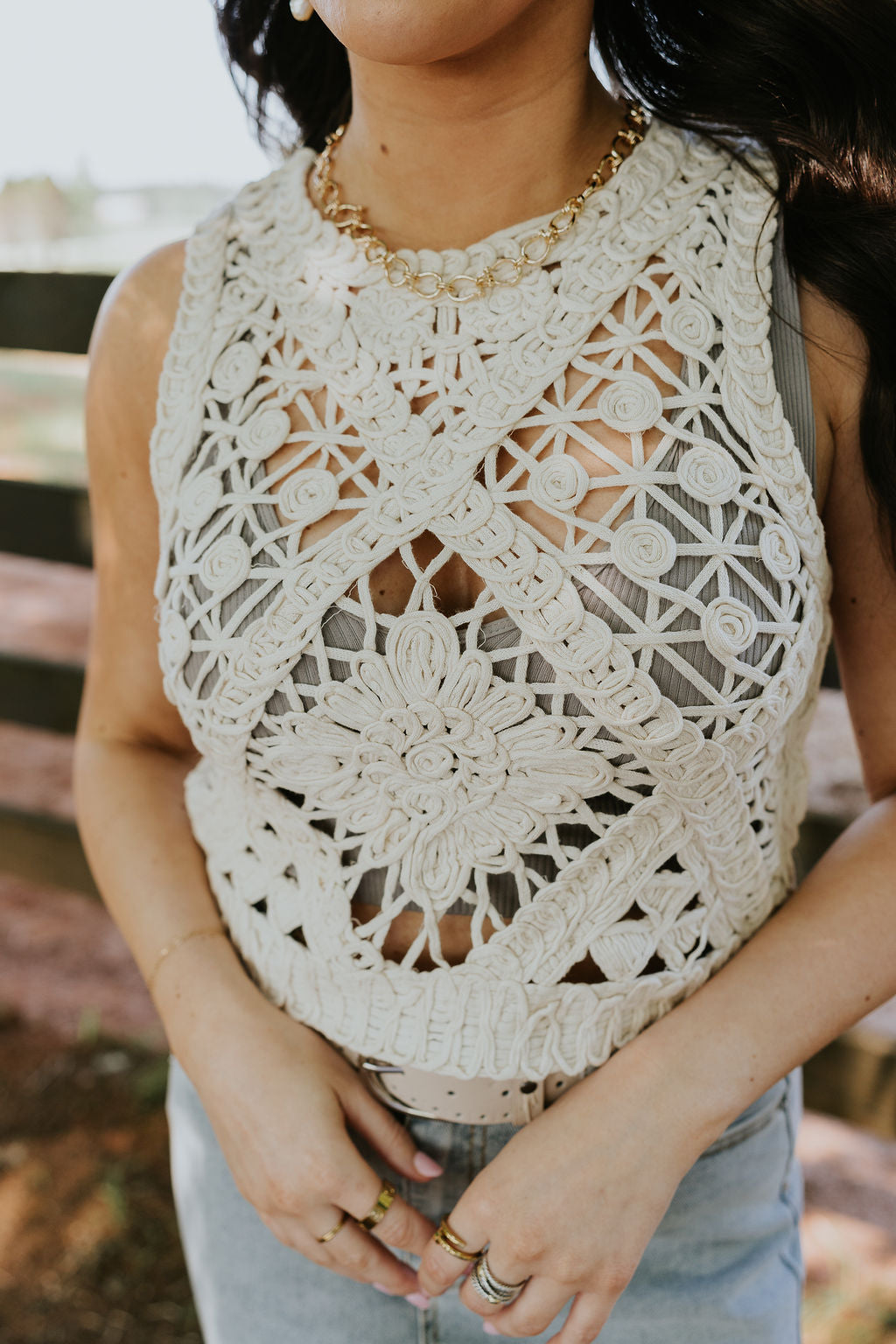 Close up view of female model wearing the Clara Natural Crochet Medallion Tank which features Natural Open Knit Fabric, Medallion Pattern Design, Round Neckline and Sleeveless