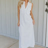 Front view of female model wearing the Alayna White Linen Sleeveless Maxi Dress which features White Linen Fabric, Fray Hem Details, Quarter Button-Up, Collared Neckline and Sleeveless
