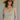 front view of female model wearing the Elsie Stripe V-Neckline Tank which features Stripe Lightweight Fabric, V-Neckline, Cropped Waist, Thick Hem and Sleeveless. the tank is available in black, olive and rust.
