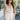 Front view of female model wearing the Ivy White Drawstring Tie Shorts which features White Lightweight Fabric, Pockets On Each Side, Elastic Waistband and Drawstring Tie