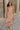 Full body view of female model wearing the Lyla Peach Satin Midi Dress which features Peach Satin Fabric, Maxi Length, Strapless Design, Back Cut-Out Design and Monochrome Side Zipper with Hook Closure