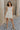 Full body view of female model wearing the Blakely Ecru Crochet Babydoll Mini Dress which features  Ecru Lightweight Fabric, Ecru Crochet Knit Upper, Ecru Lining, Mini Length, Tie Straps and Scoop Neckline