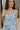 Close up view of female model wearing the Lainey Blue & White Cropped Tank which features Blue and White Lightweight Fabric, White Lining, Monochrome side zipper with hook closure, Square Neckline and Thick Straps