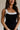 close up view of female model wearing the Marissa Black & White Trim Midi Dress which features Black Lightweight Fabric, Midi Length, Black Lining, White Trim Details, Back Slit , Square Necklineand Side Monochrome Zipper with Hook Closure