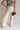 front view of female model wearing the Luna Natural & Black Belt Wide Leg Pants which features Cream Linen Fabric with Black Details, Side Pockets, Back Pockets, Wide Leg Pants, Monochrome Adjustable Buckle and Front Zipper with Hook Closure