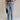 Front view of female model wearing the Eliana Medium Wash Straight Leg Jeans which features Medium Wash Denim Fabric, Straight Leg, High Waist, Two Front Pockets, Two Back Pockets, Front Zipper with Button Closure and Belt Loops