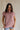Front view of female model wearing the Arana Knit Short Sleeve Top which features Lightweight Knit Fabric, Slight Slit Details, Front Left Chest Pocket, Round Neckline and Short Sleeves. the top is available in beige and mauve