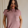 Front view of female model wearing the Arana Knit Short Sleeve Top which features Lightweight Knit Fabric, Slight Slit Details, Front Left Chest Pocket, Round Neckline and Short Sleeves. the top is available in beige and mauve