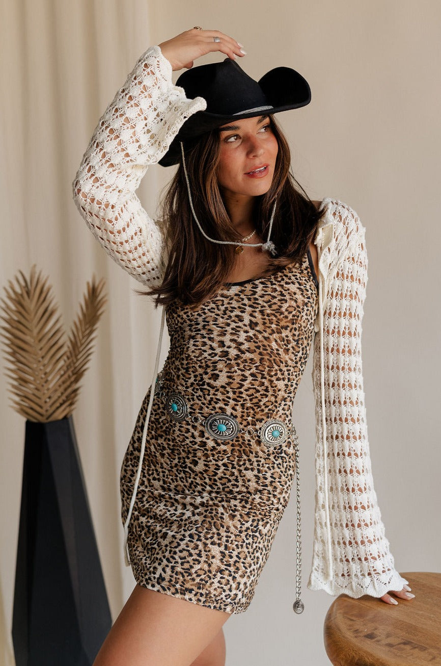 Front view of female model wearing the Alexandra Leopard Sleeveless Mini Dress which features Leopard Lightweight Fabric, Mini Length, Scooped Neckline and Adjustable Straps
