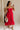 Full body view of female model wearing the Sarah Red Ruffle Hem Midi Dress which features Red Lightweight Fabric, Flare Hem Skirt, Midi Length, Red Lining, Ruched Upper, Strapless and Smocked Back