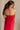 back view of female model wearing the Sarah Red Ruffle Hem Midi Dress which features Red Lightweight Fabric, Flare Hem Skirt, Midi Length, Red Lining, Ruched Upper, Strapless and Smocked Back