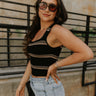 Side view of female model wearing the Shayna Stripe Square Neckline Tank which features Ribbed Fabric, Stripe Pattern, Square Neckline and Sleeveless. the tank is available in black and white