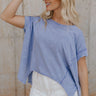 Front view of female model wearing the Nova Thread Short Sleeve Top which features Cotton Fabric, Curved Hem Details, Round Neckline and Shorts Sleeves. the top is available in blue and white