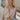 Front view of female model wearing the Emilia Satin Plunge Neckline Sleeveless Bodysuit which features Satin Fabric, Surplice Neckline with Button Snap, Sleeveless and Thong Bottom with Button Closure. the bodysuit is available in taupe and white