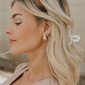 Side view of model wearing the Liza Gold Earrings.