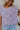 Front view of female model wearing the Full body view of female model wearing the Camille Lavender Knit Side Ties Short Sleeve Top which features Lavender Knit Fabric, Short Sleeves, Round Neckline, Scalloped Hem Details and Cream Side Tie Details