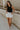 Full body view of female model wearing the Lianna Black Sleeveless Tank which features Black Lightweight Fabric, Black Lining, Round Neckline and Sleeveless