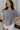 Front view of female model wearing the Ada Washed Cotton Short Sleeve Top which features Washed Cotton Fabric, Short Sleeves, Textured Thread Hem Details, Left Front Chest Pocket and Round Neckline