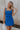 Front view of female model wearing the Grace Side Ruched Square Neckline Mini Dress which features Lightweight Linen Fabric, Fully Lined, Mini Length, Square Neckline, Ruched Side Detail, Adjustable Straps and Monochrome Back Zipper with Hook Closure. the dress is available in blue and white
